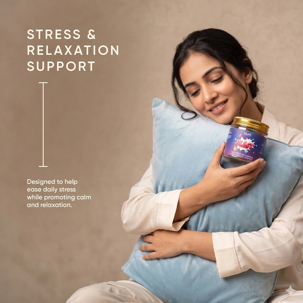 Woman holding a Blunt Blast CBD gummies jar labeled 'Stress & Relaxation Support' against a beige background