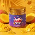 Jar of Blunt Essential Blast CBD THC full spectrum gummies surrounded by mangoes on a yellow background